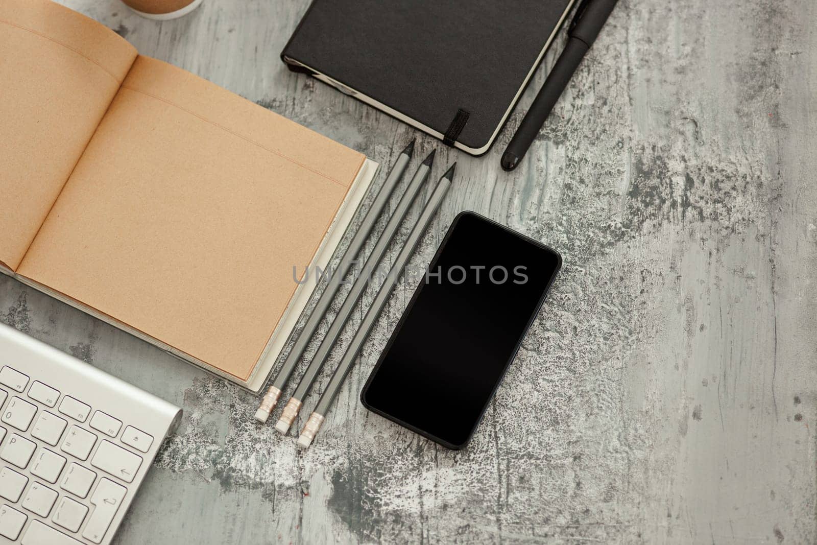 Office desk table with computer, supplies and mobile phone