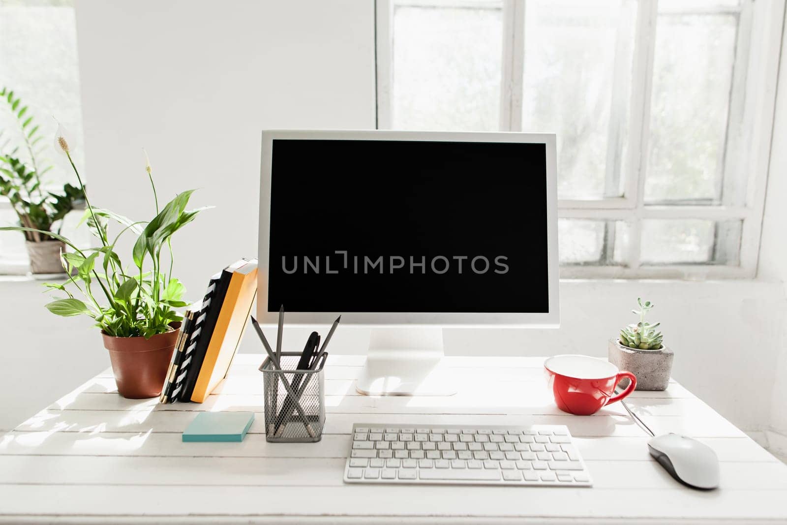 Stylish white workspace with computer at home or studio