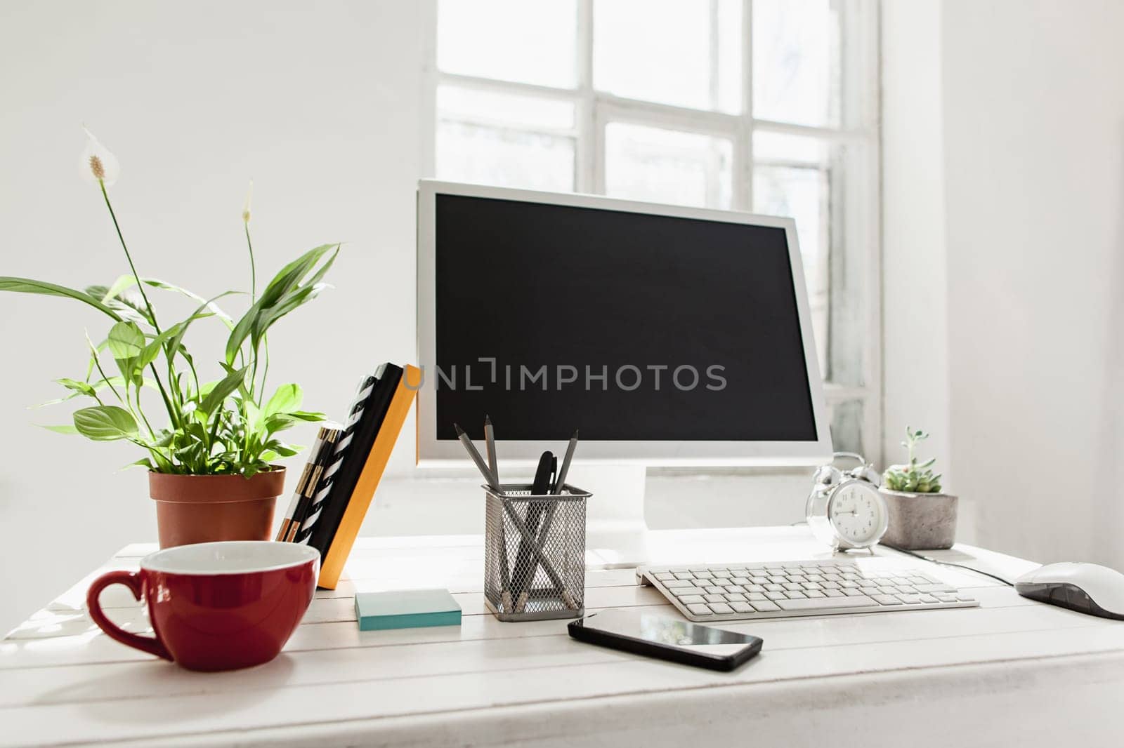 Stylish white workspace with computer on home or studio