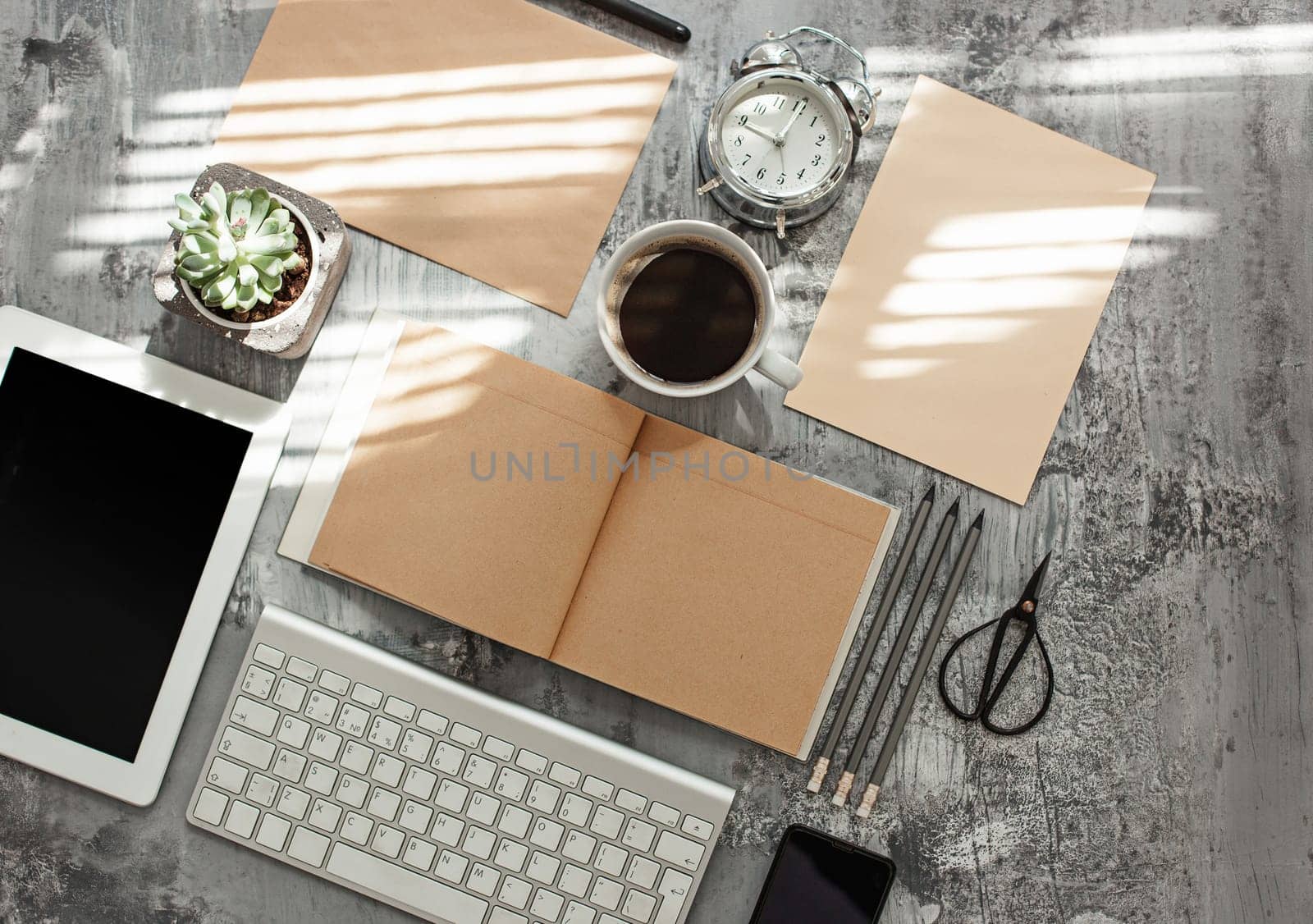 Office desk table with computer, supplies and mobile phone