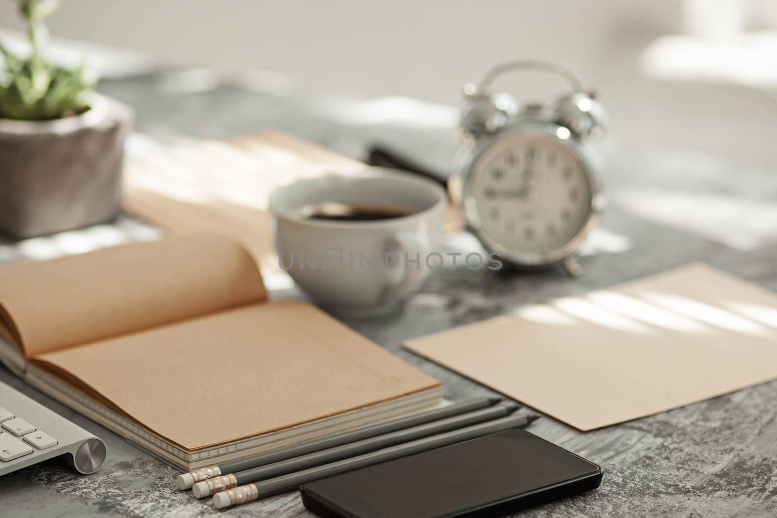 Office desk table with computer, supplies and mobile phone