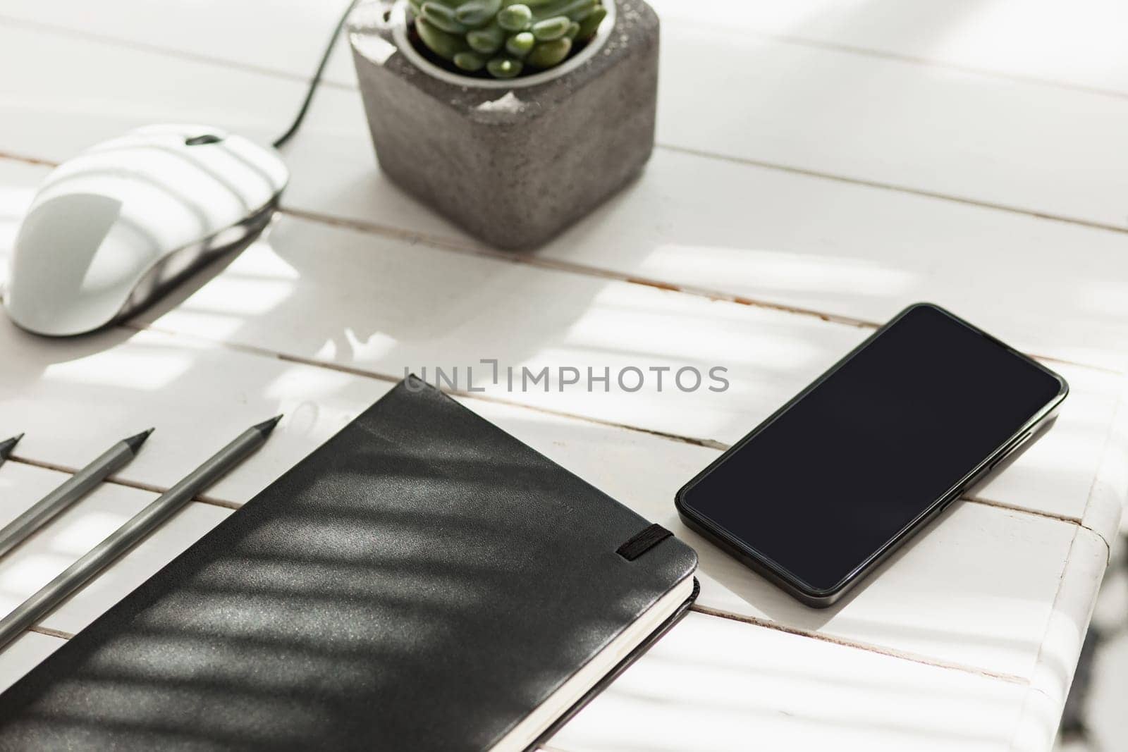 Office desk table with computer, supplies and mobile phone