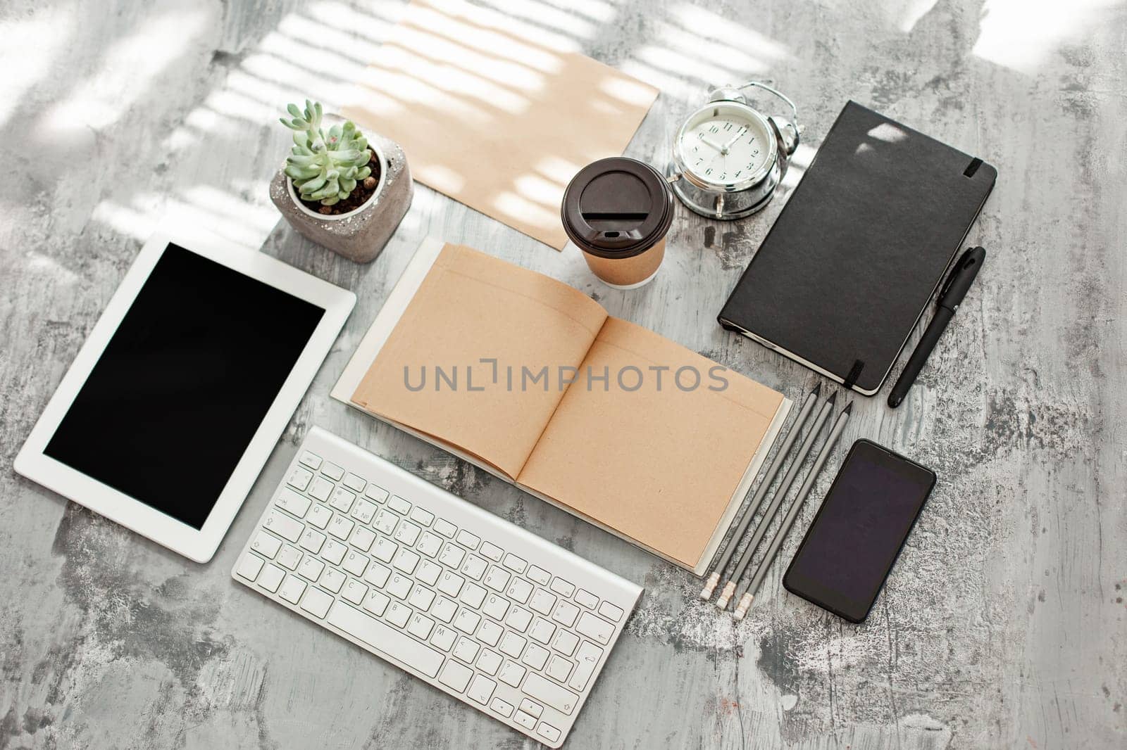 Office desk table with computer, supplies and mobile phone
