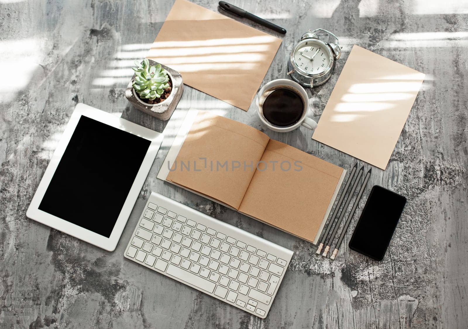 Office desk table with computer, supplies and mobile phone