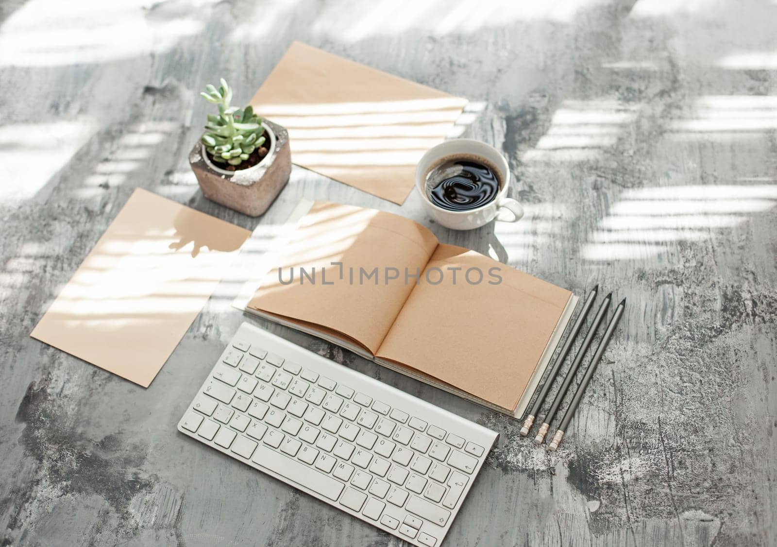Office desk table with computer, supplies and mobile phone