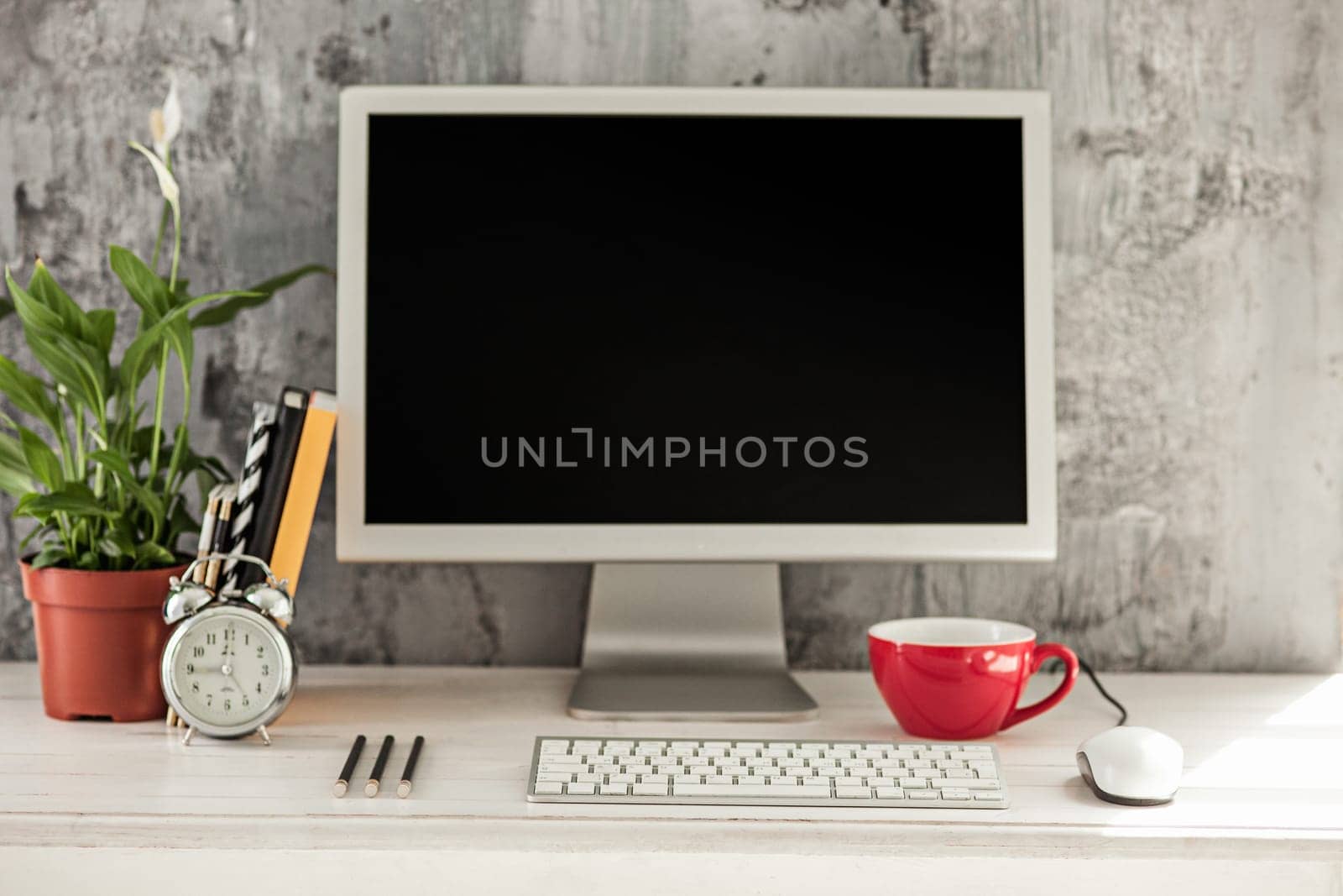 Stylish white workspace with computer at home or studio