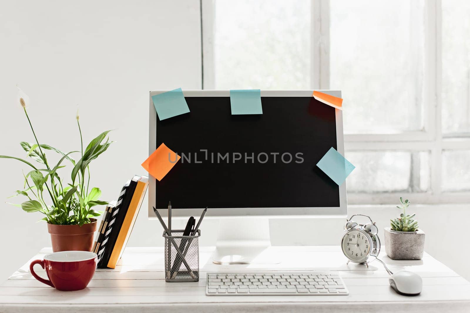 Stylish white workspace with computer on home or studio