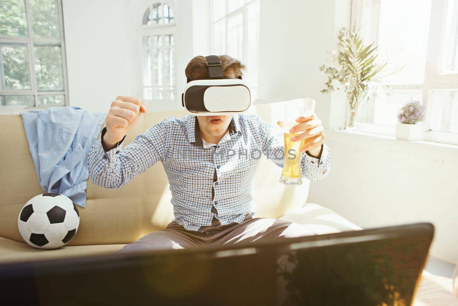The man with glasses of virtual reality at home. Future technology concept.