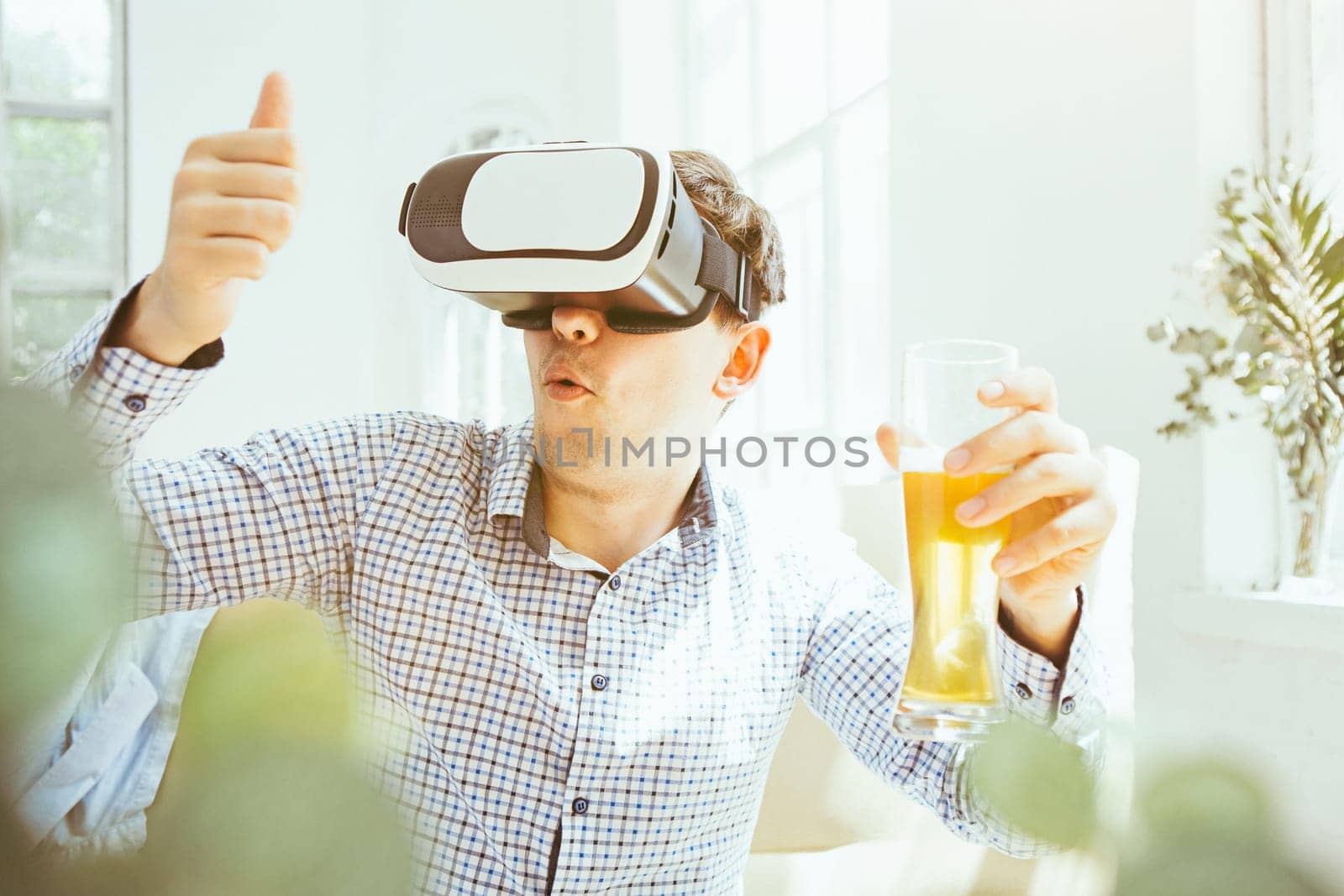 The man with glasses of virtual reality at home. Future technology concept.
