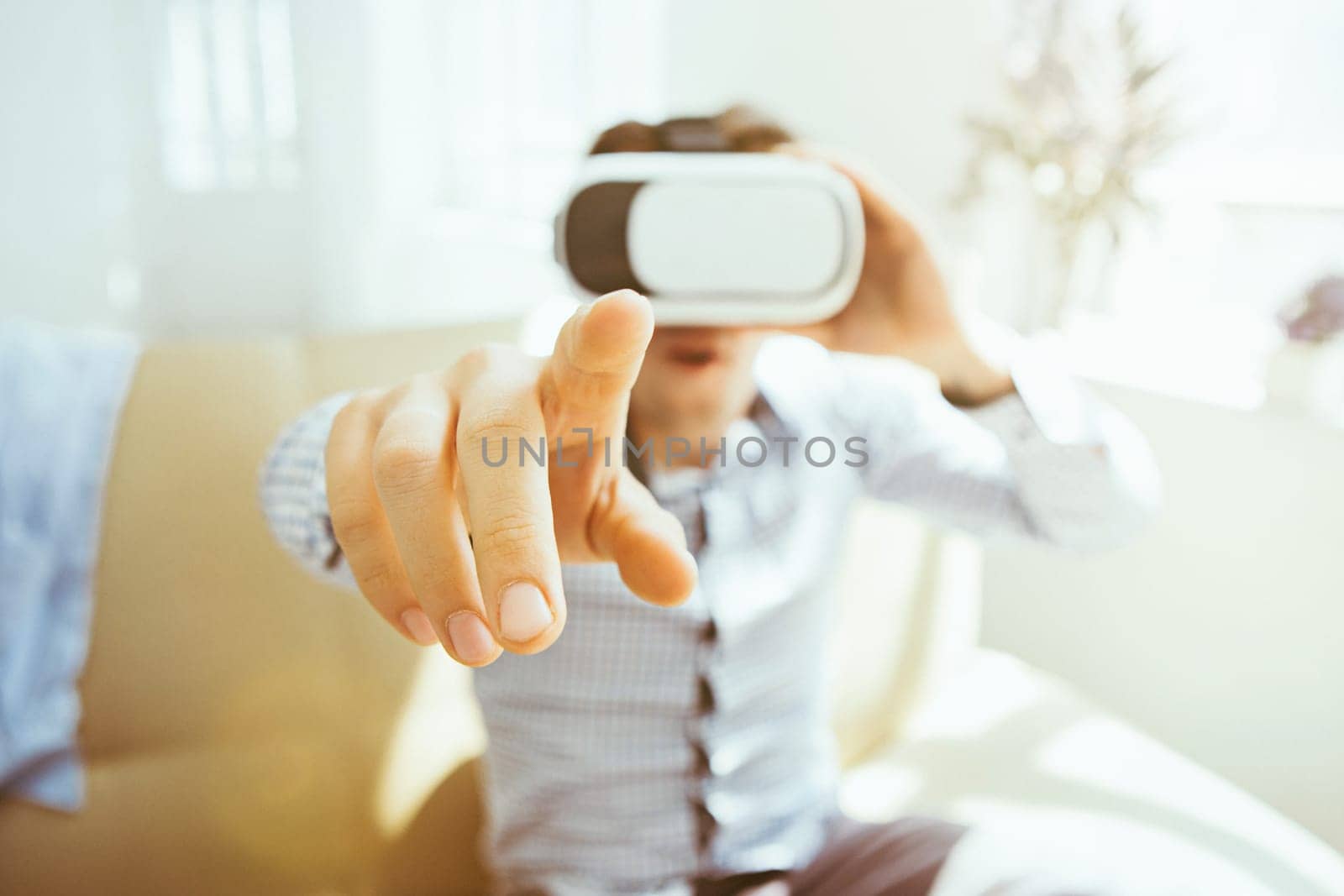 The man with glasses of virtual reality at home. Future technology concept.