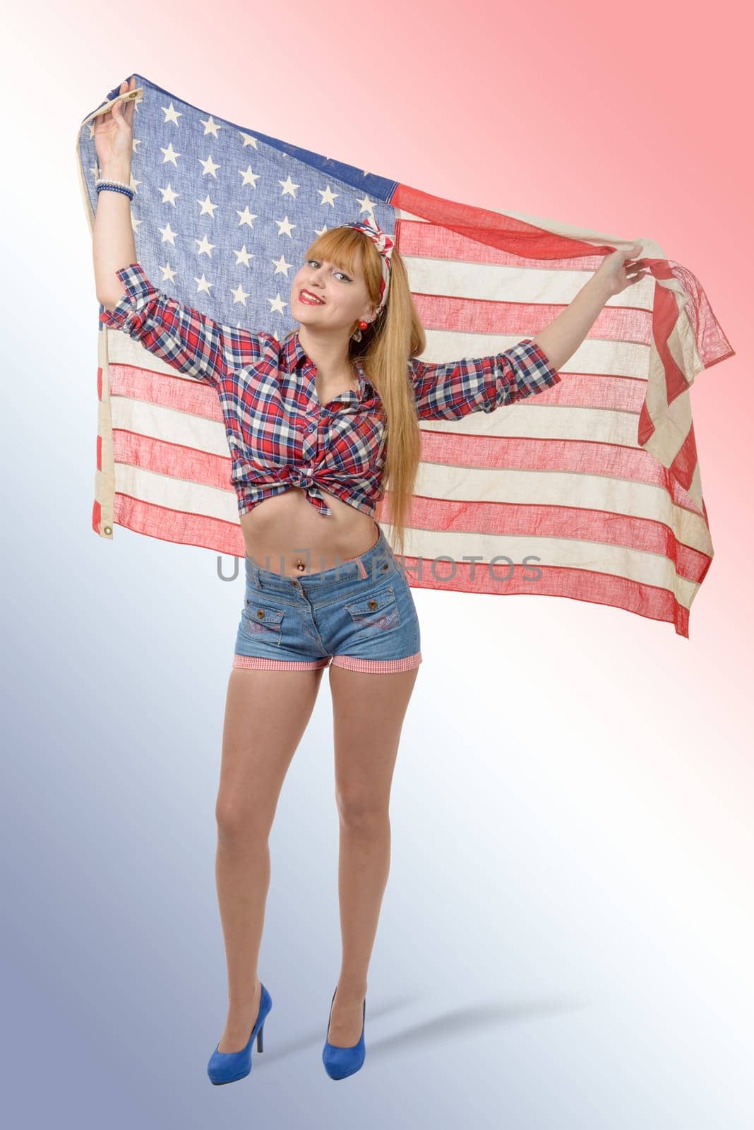 a sexy pin up girl  holding an American flag.