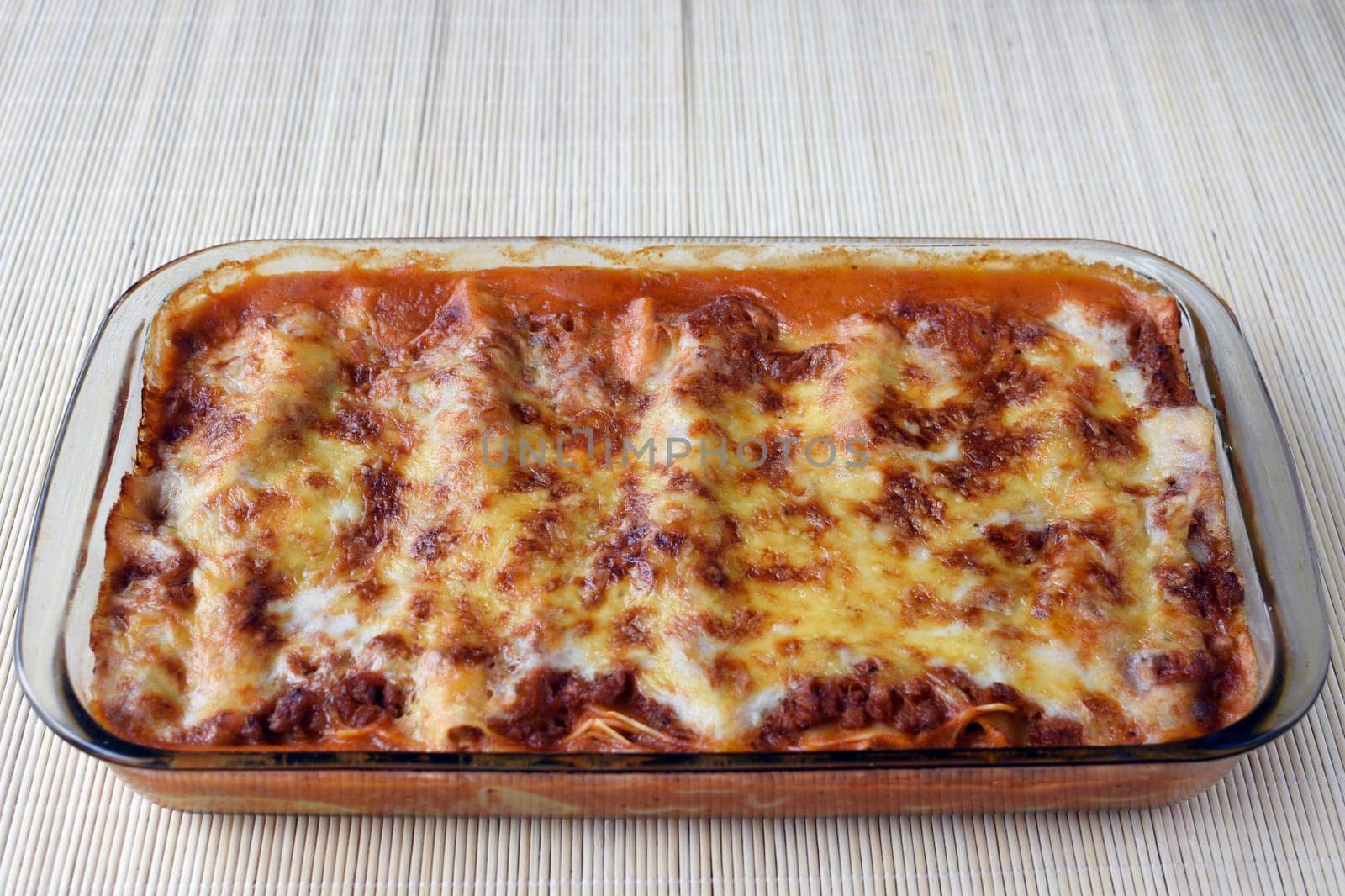 Lasagna, the Italian food is in fireproof glass bowl.