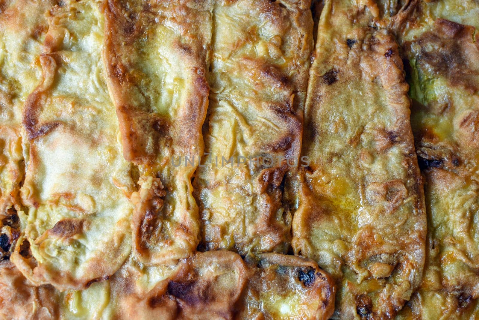 Close-up photo about baked food from zucchini.