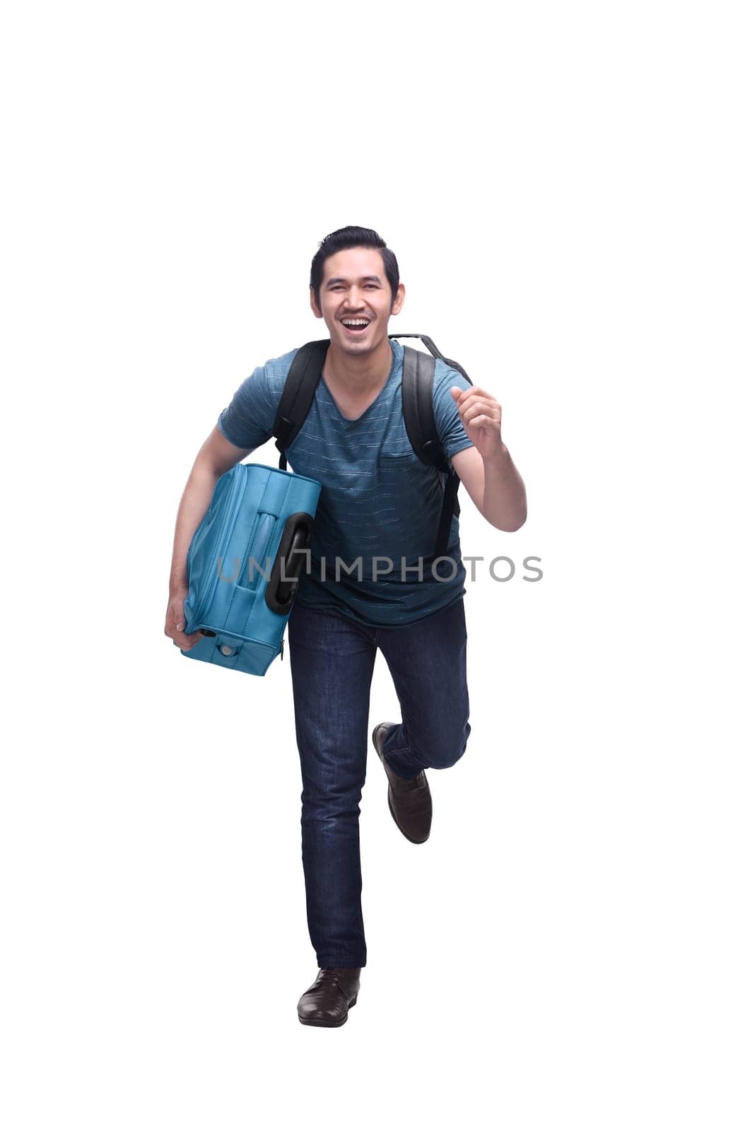 Attractive asian travelling man with suitcase running isolated over white background