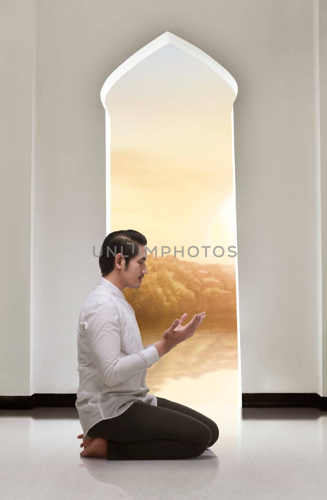 Religious asian muslim man kneeling and praying on the mosque