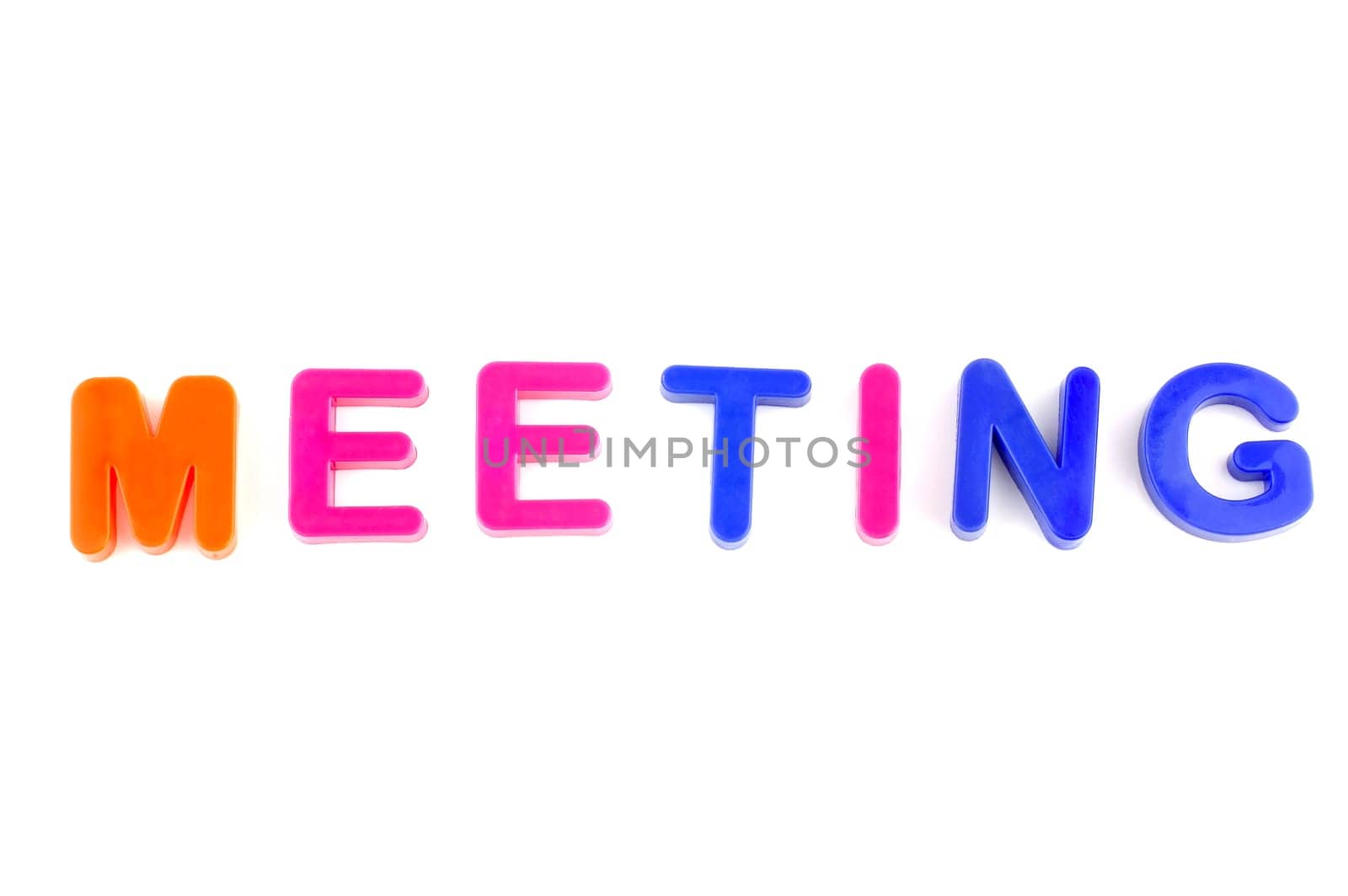 Word meeting isolated on white background made from colorful toys letters