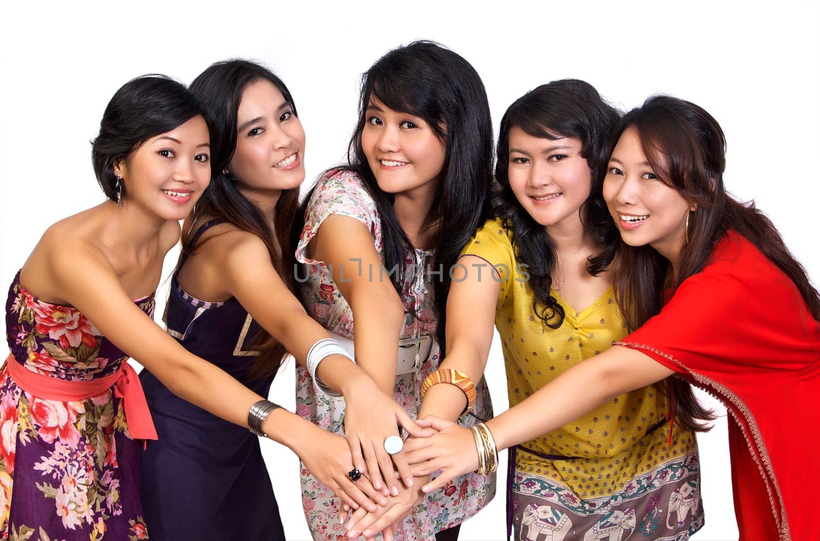 Happy group of attractive young women smiling isolated on white background