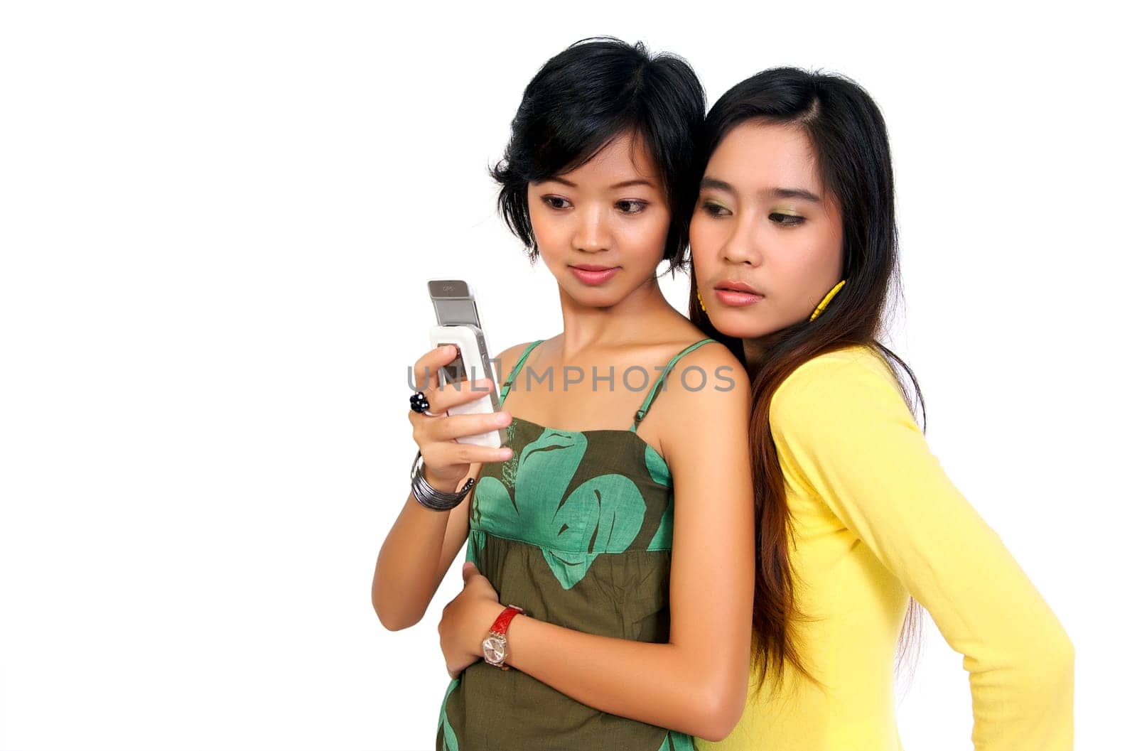 Two girls reading bad news SMS on white background