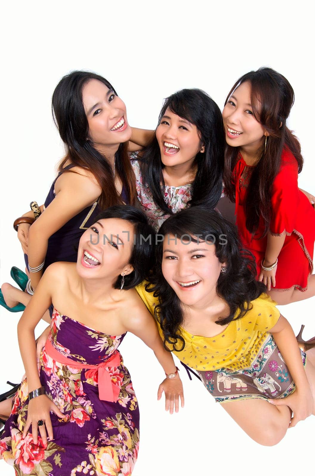 Happy group of attractive young women smiling isolated on white background