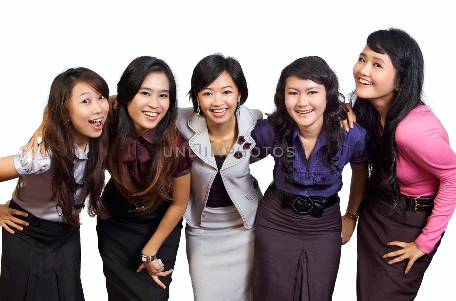 Happy group of attractive young women smiling isolated on white background