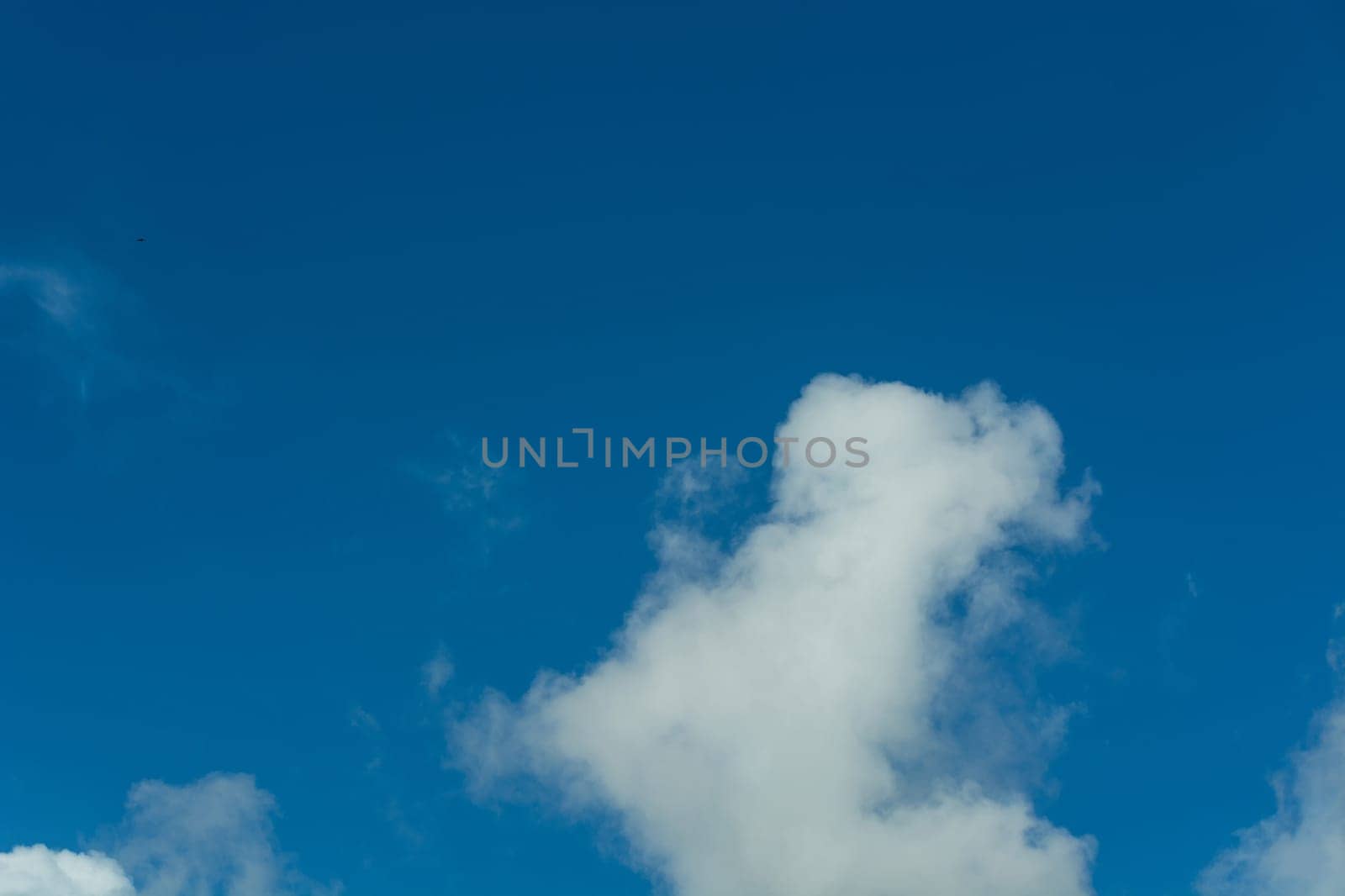 Cloudscape, white clouds in the summer sky
