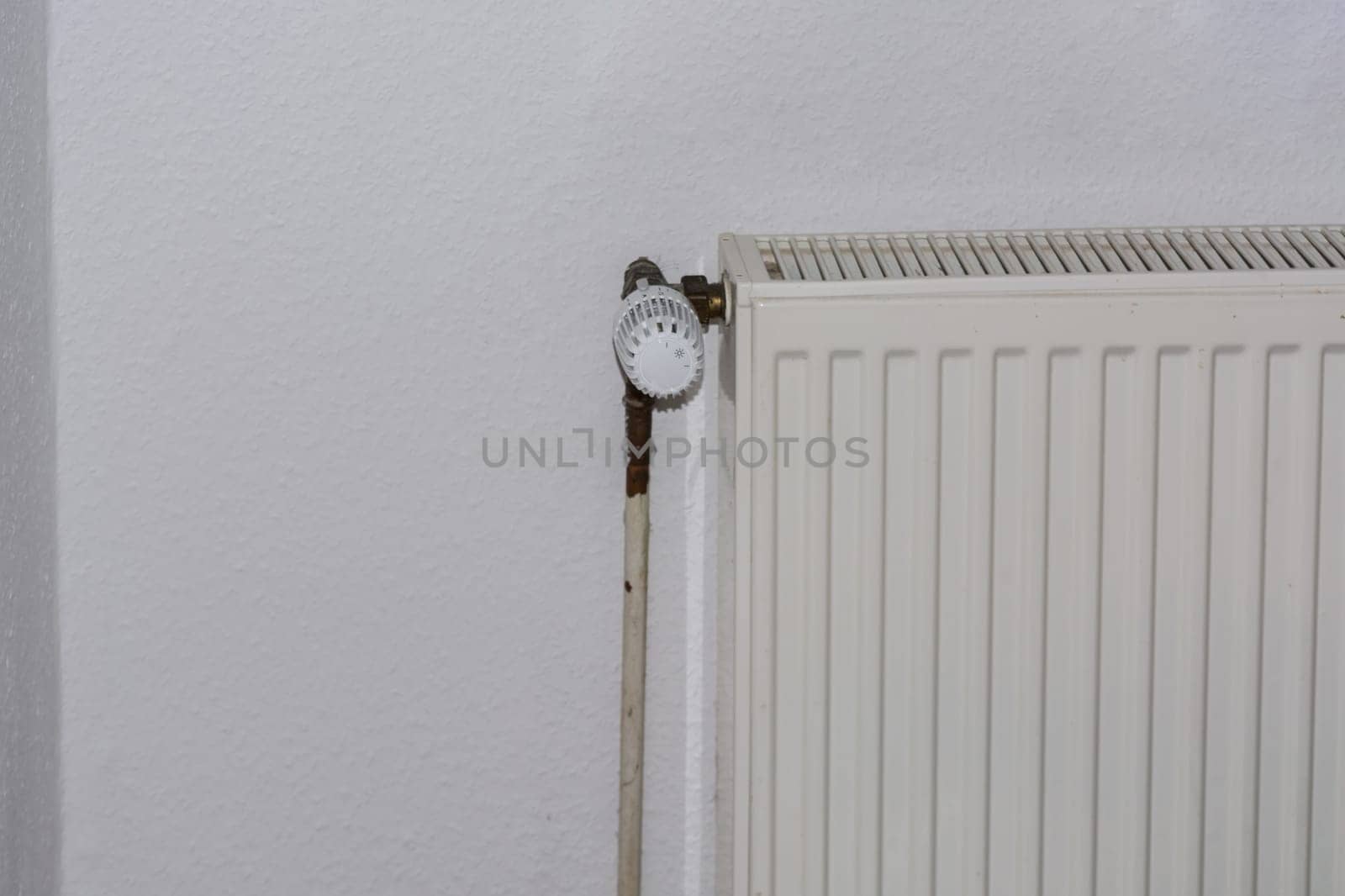 Old panel radiators in a renovated room.