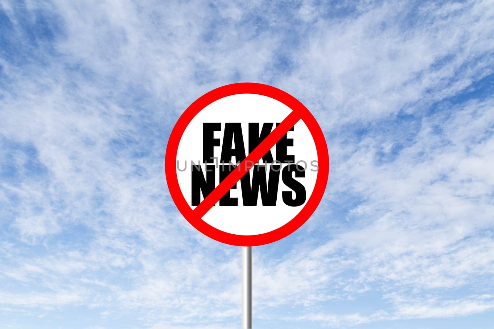 Stop fake news prohibitory traffic sign against blue cloudy sky