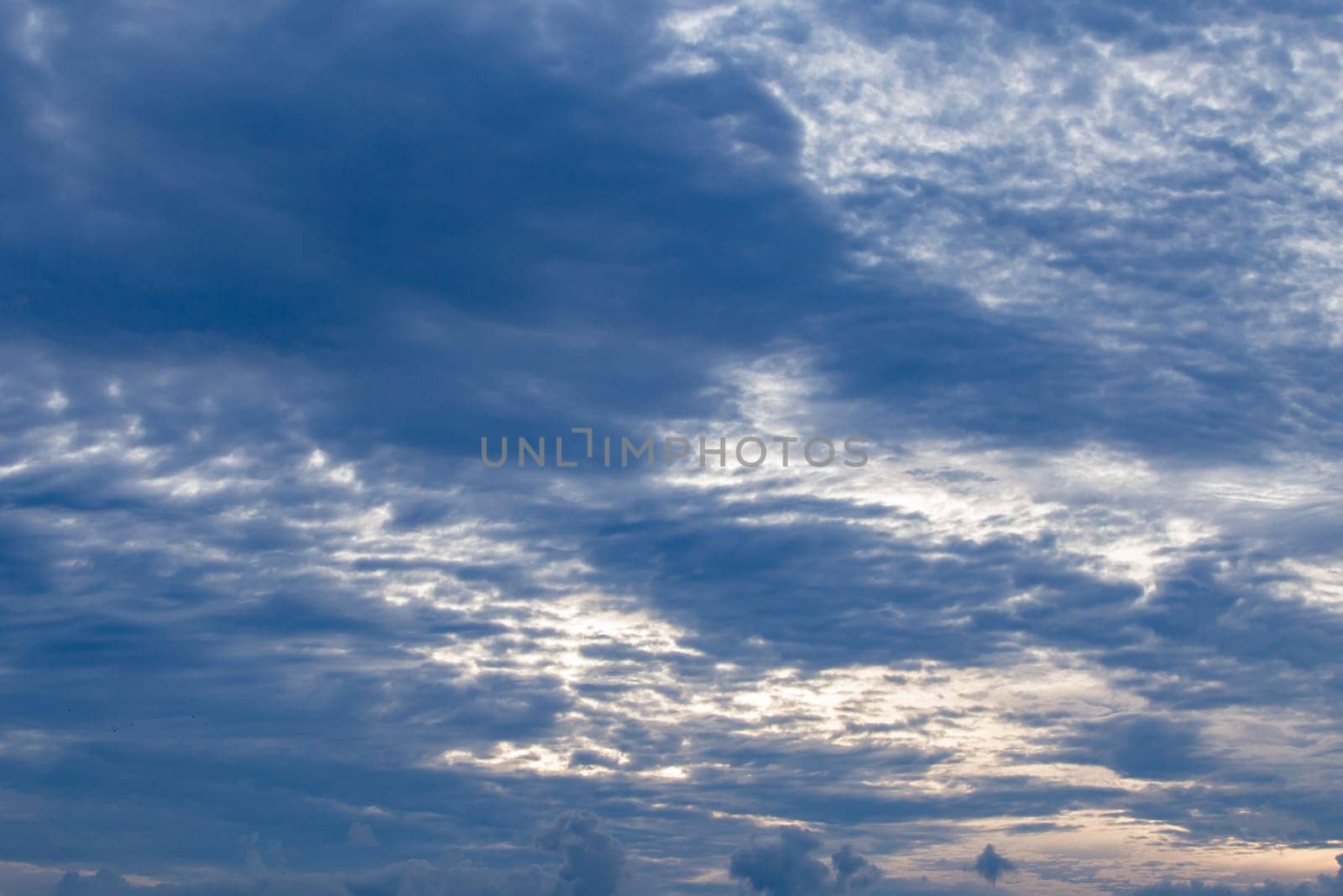 Gray storm clouds before sunset