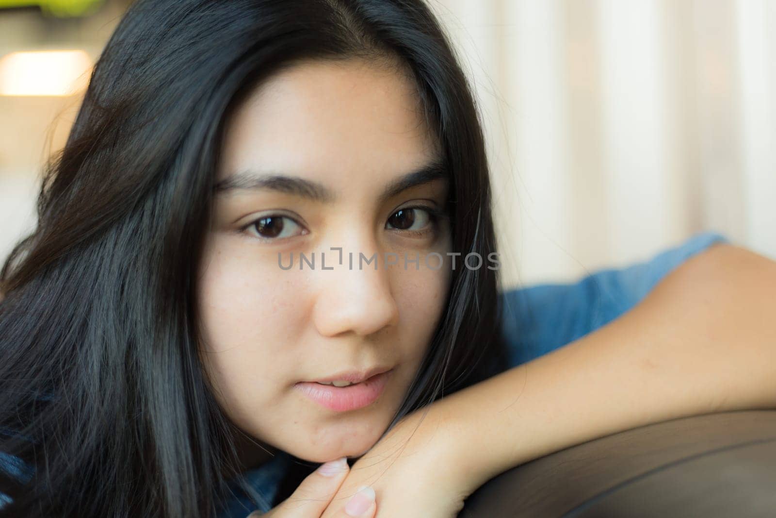 Beautiful young Asian woman in the cafe