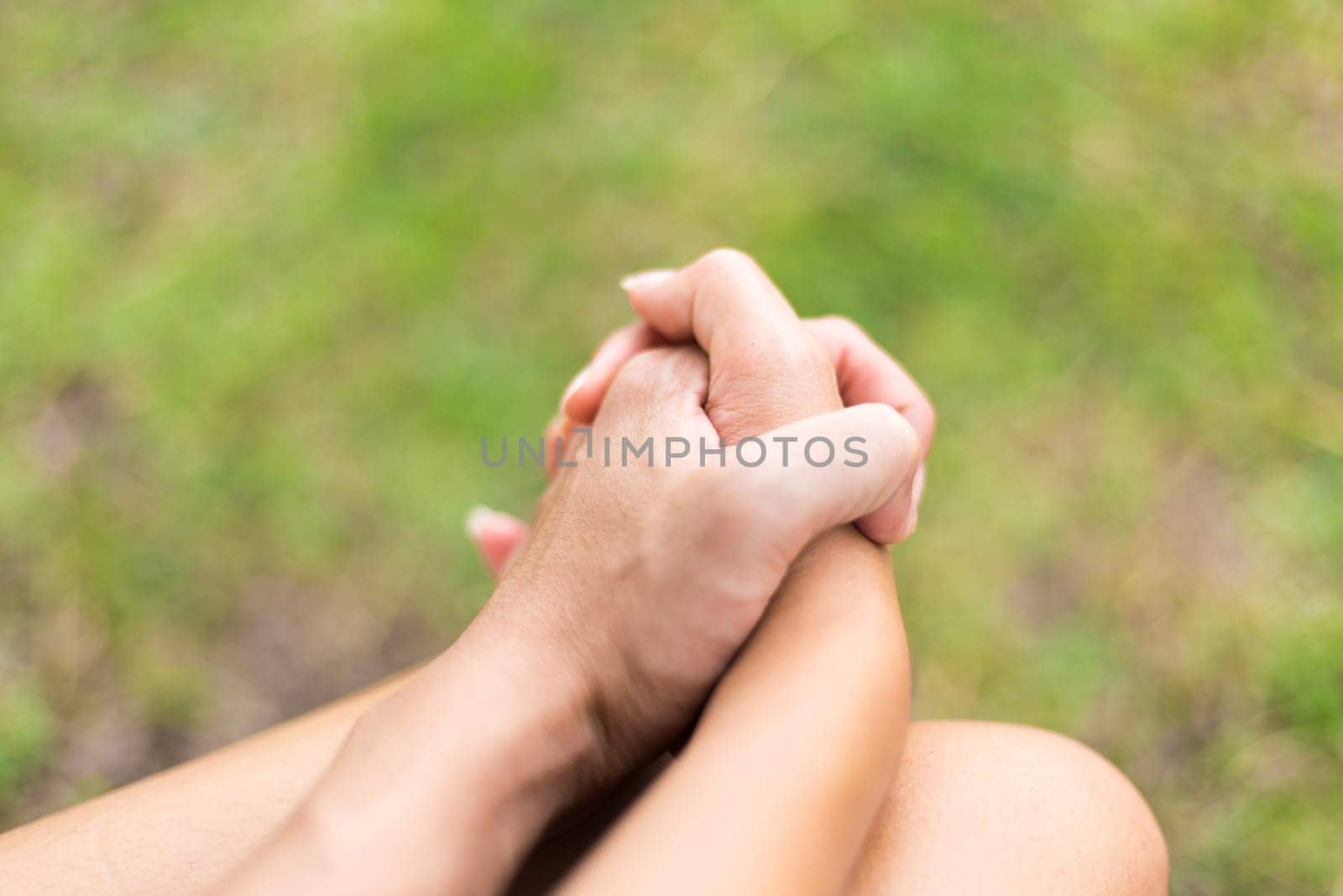Happy couple holding hands in the park, together with love concept