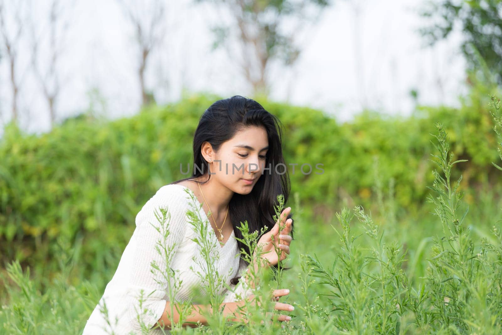 Outdoor portrait asian girl in the flowers garden