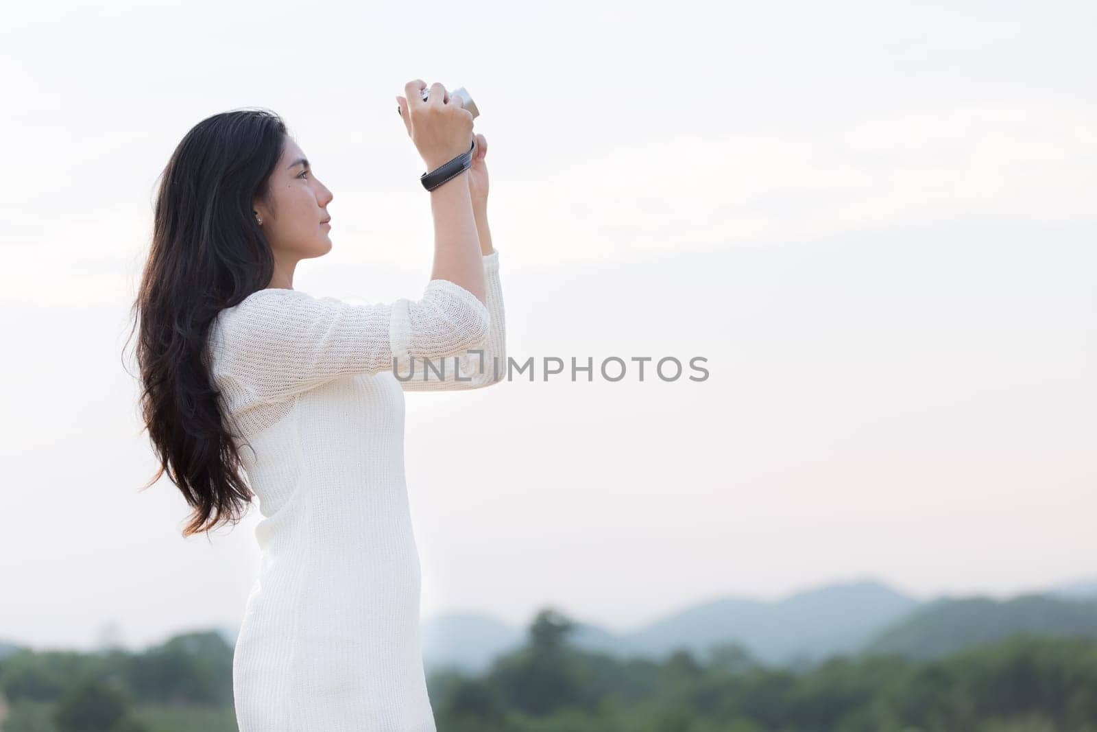 Outdoor portrait asian girl in the flowers garden