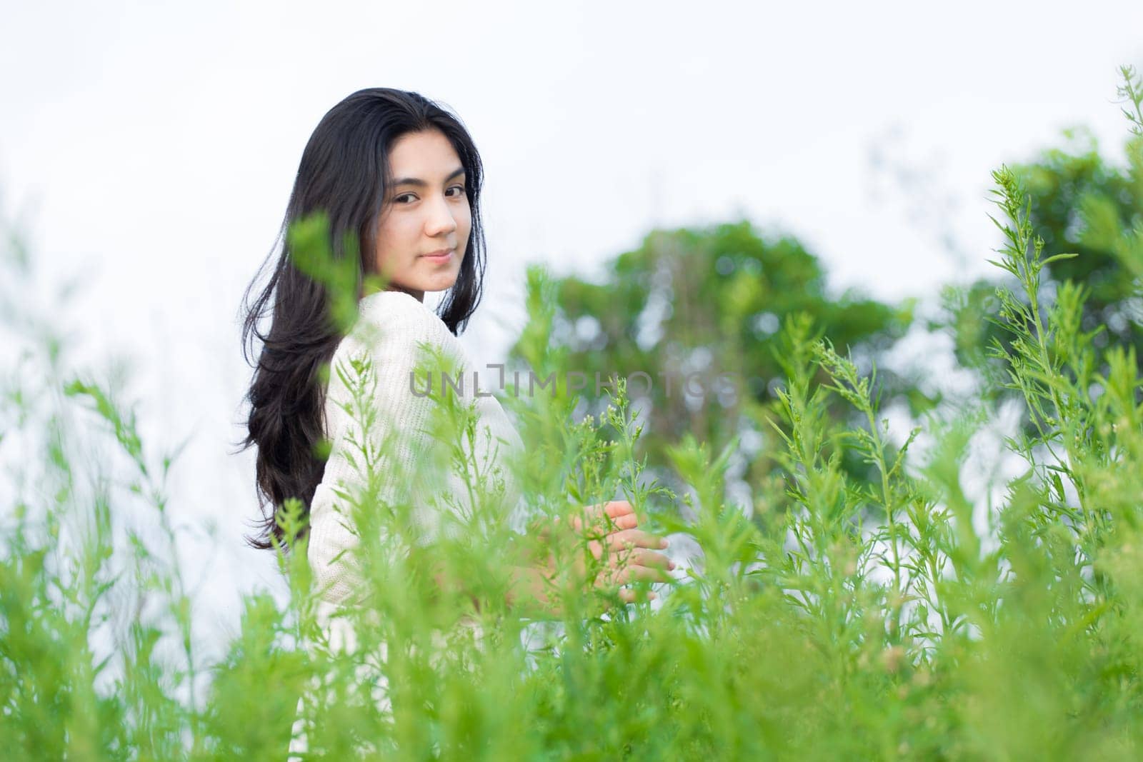Outdoor portrait asian girl in the flowers garden