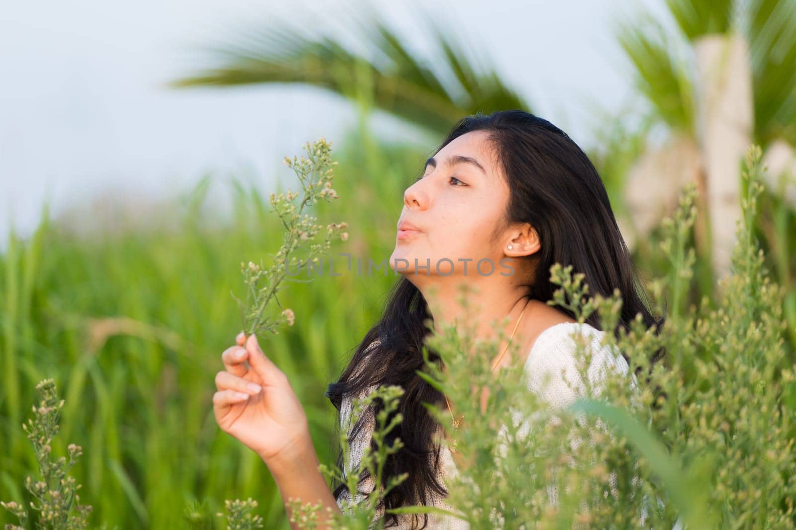Outdoor portrait asian girl in the flowers garden