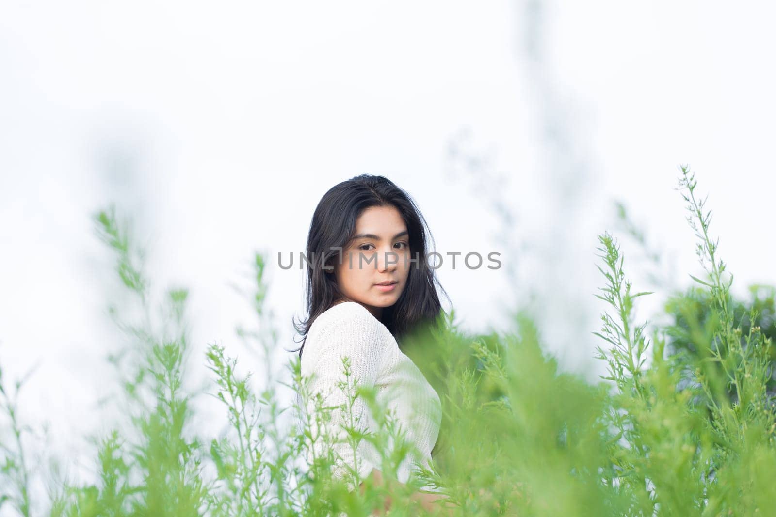 Outdoor portrait asian girl in the flowers garden