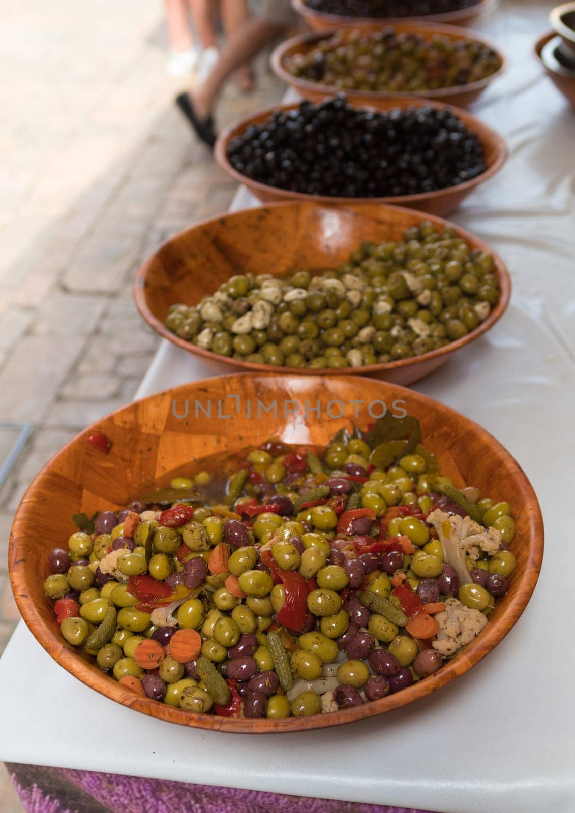 plates with fresh olives on a local french market