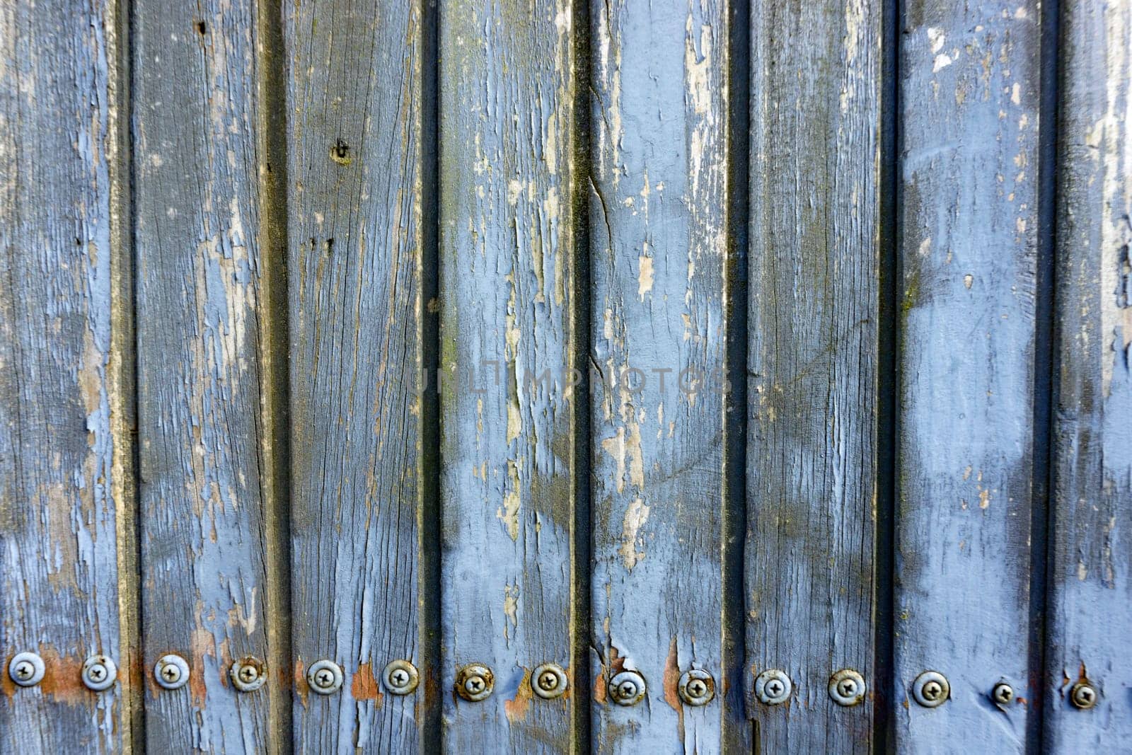 Weathered wooden boards screwed in detail as a background