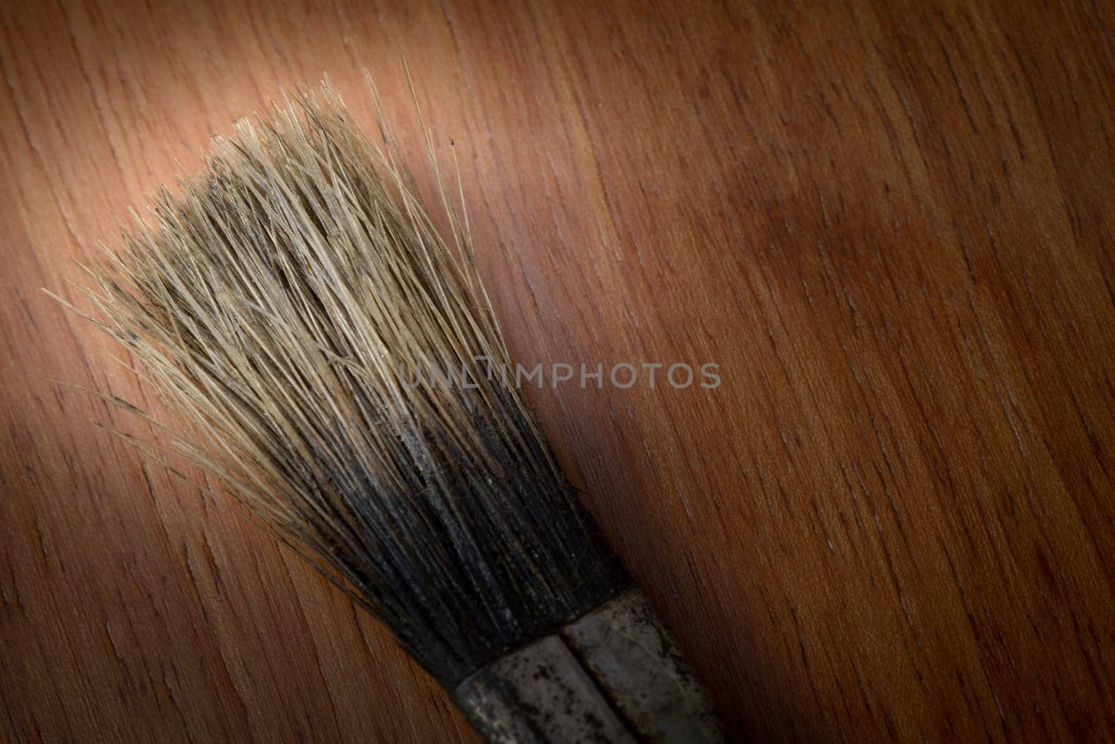 Brush tip on a wooden background