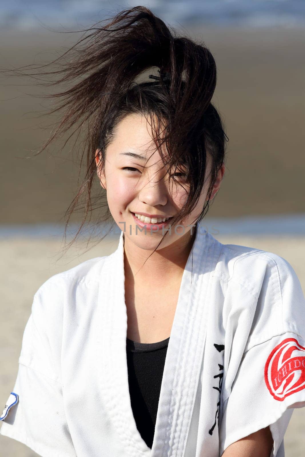 Kagawa, Japan - January 3, 2017: Japanese martial arts houses, young girl training of karate at the new year at the Ichinomiya beach.