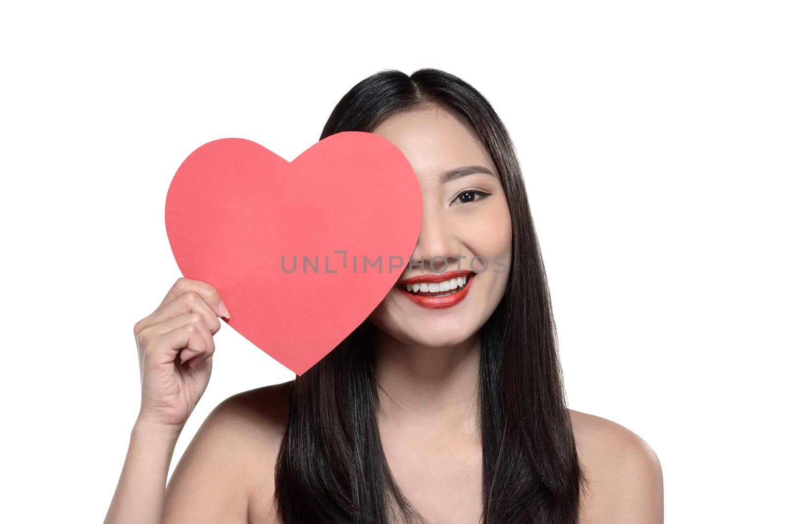 Valentine day concept. Beautiful asian girl holding red heart