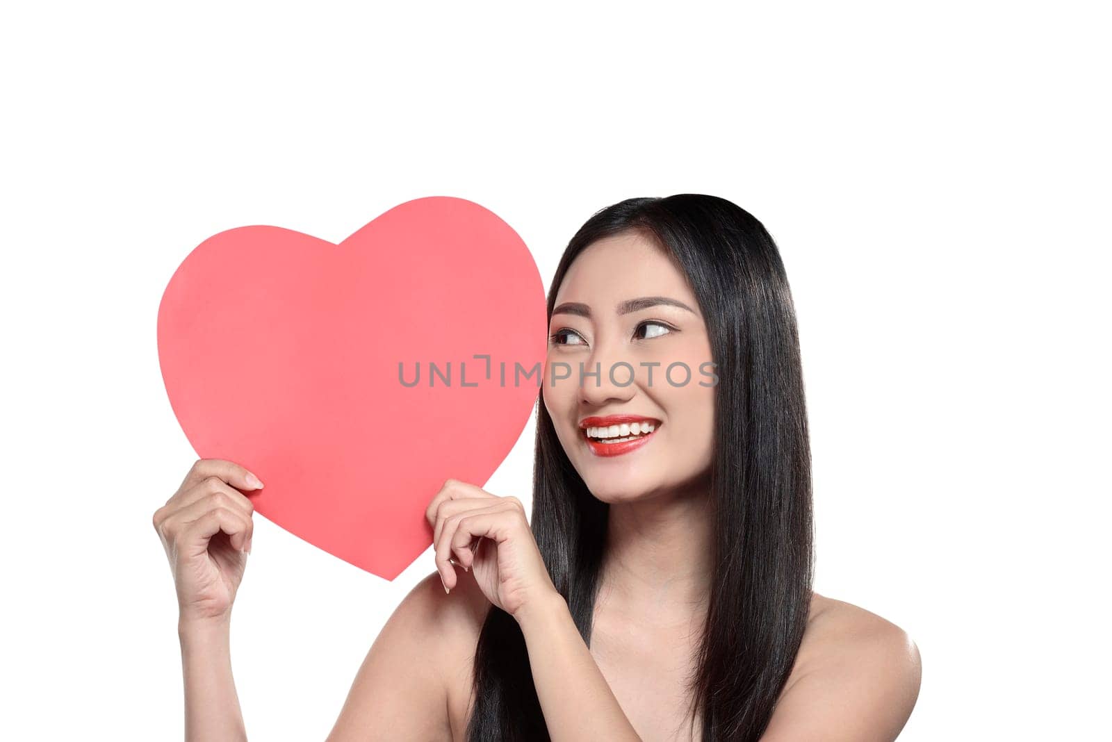 Valentine day concept. Beautiful asian girl holding red heart