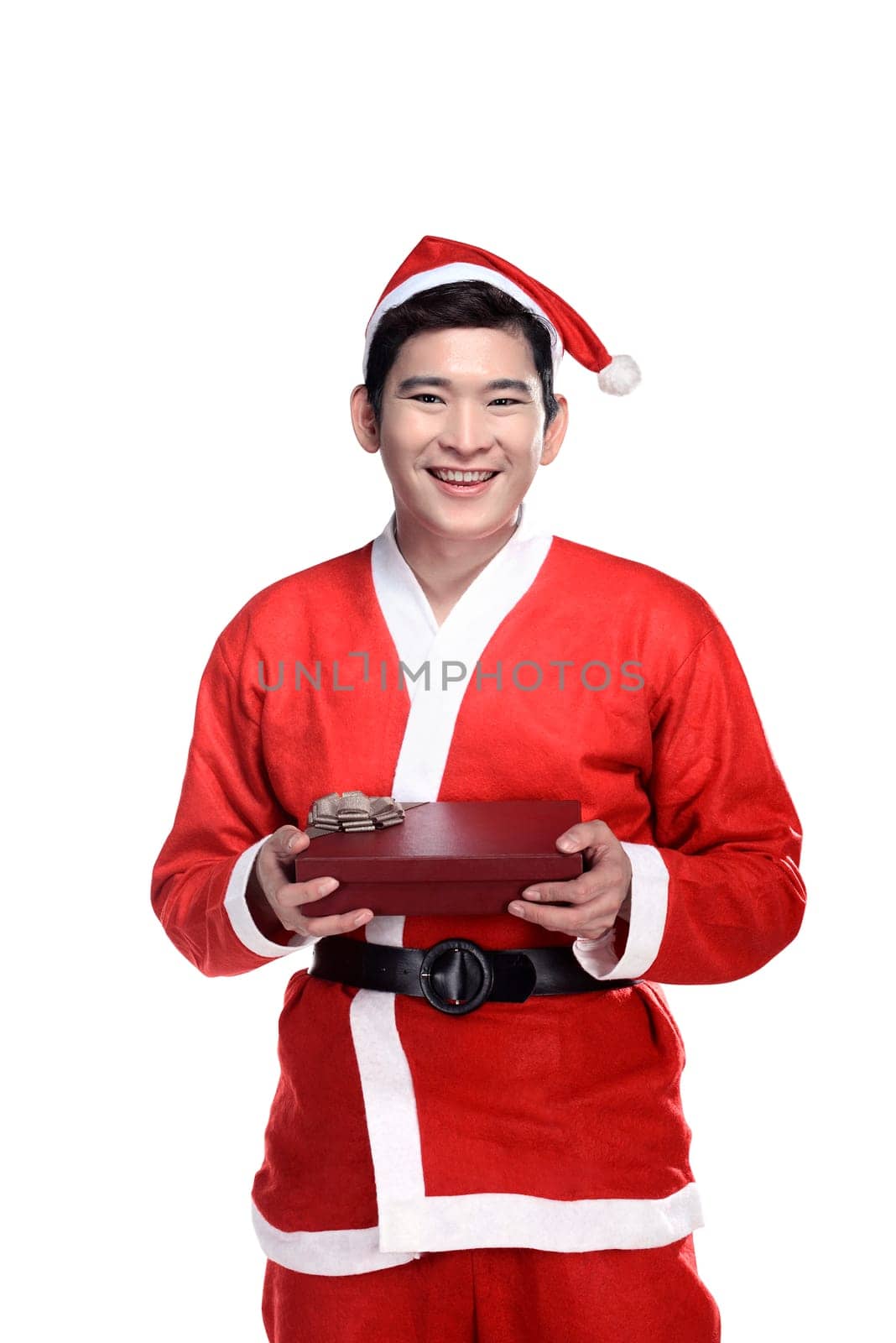 Asian man in santa claus costume holding gift box isolated over white background