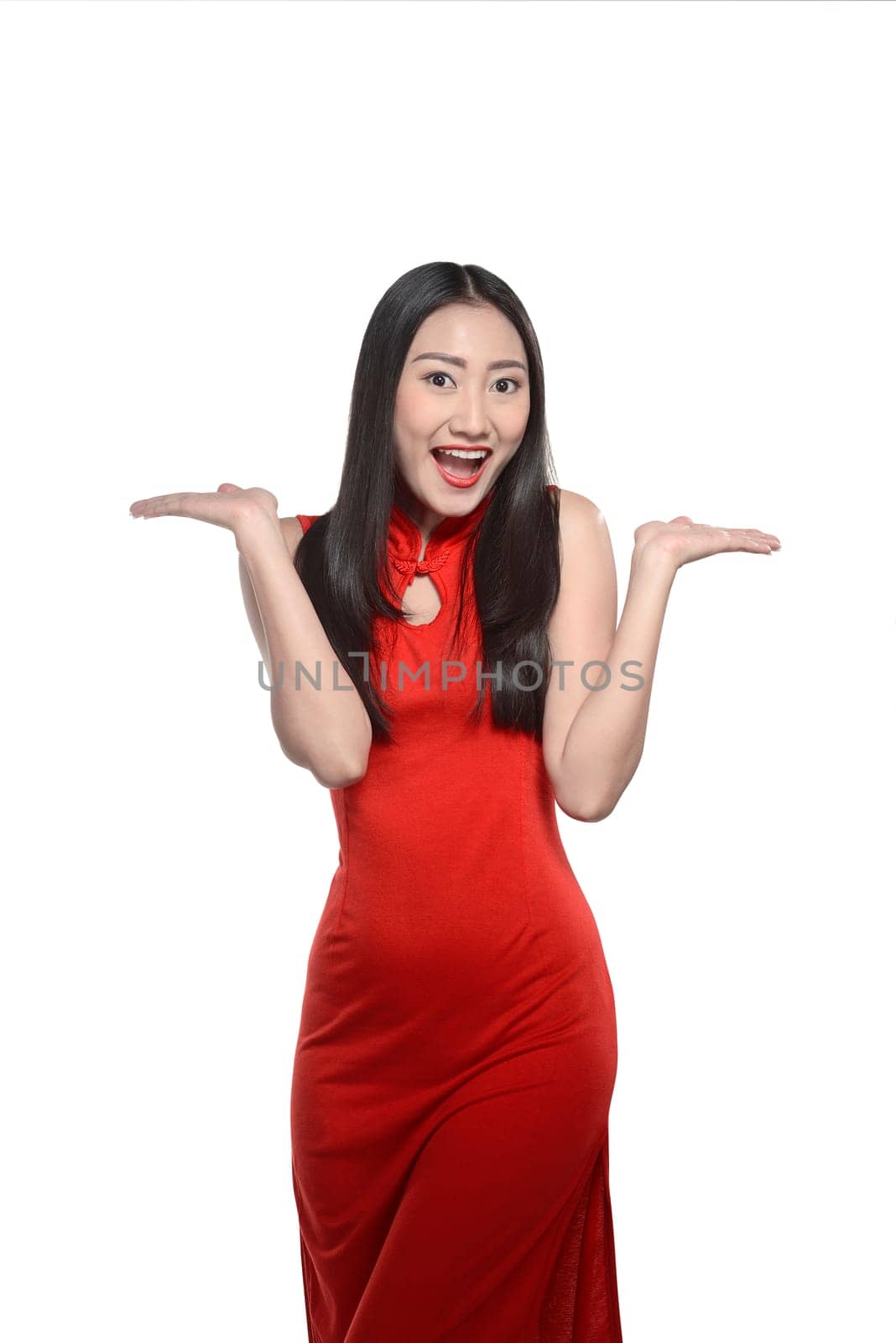 Asian woman in cheongsam dress isolated over white background. Happy chinese new year concept