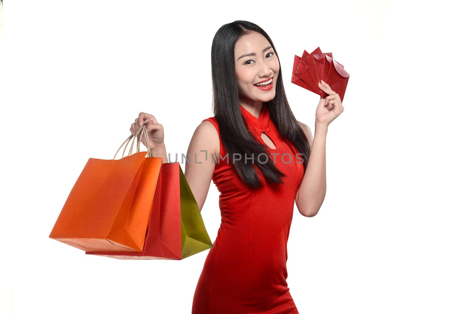 Asian woman in cheongsam dress isolated over white background. Happy chinese new year concept