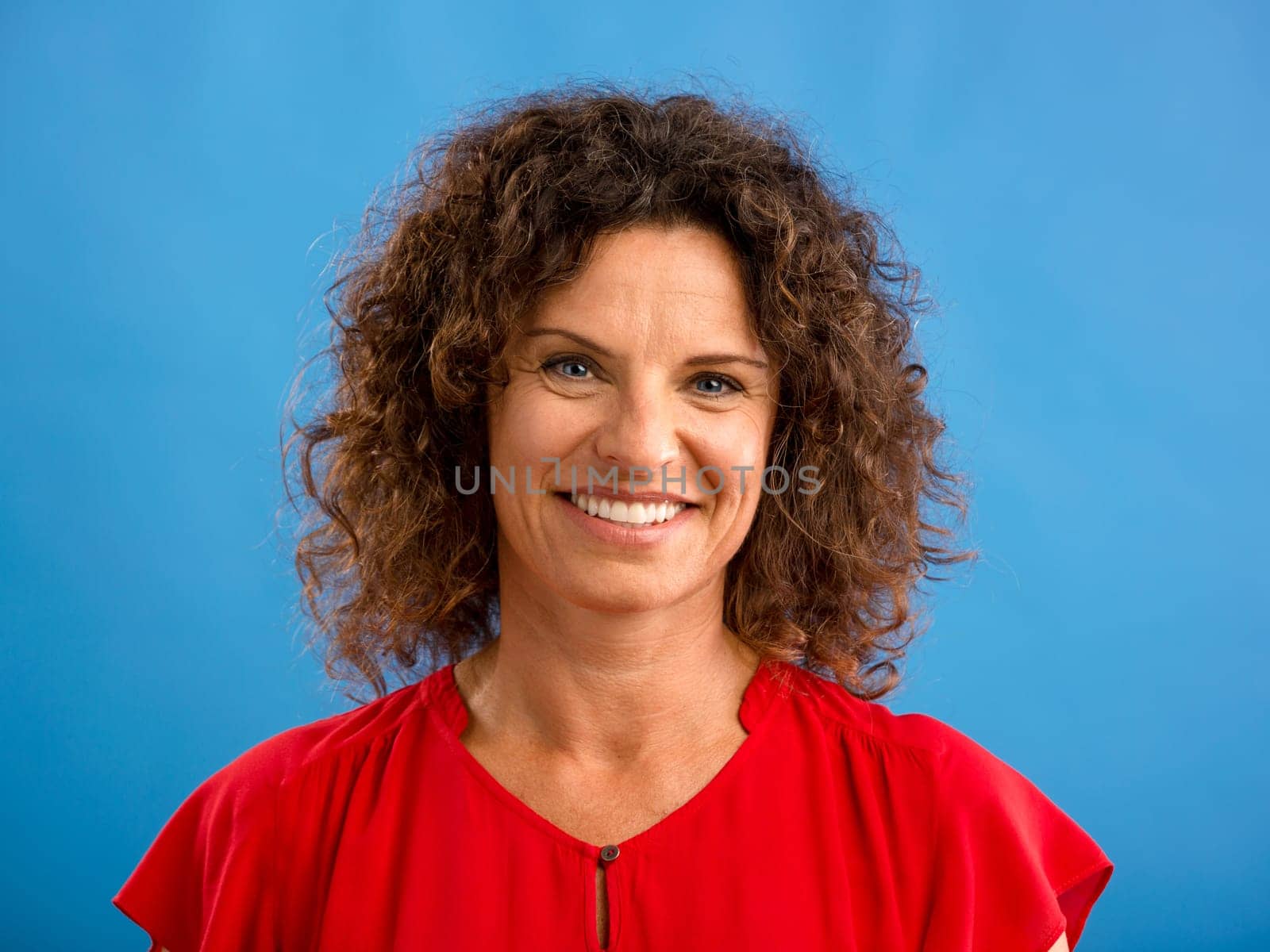 Portrait of a beautiful woman over a blue background