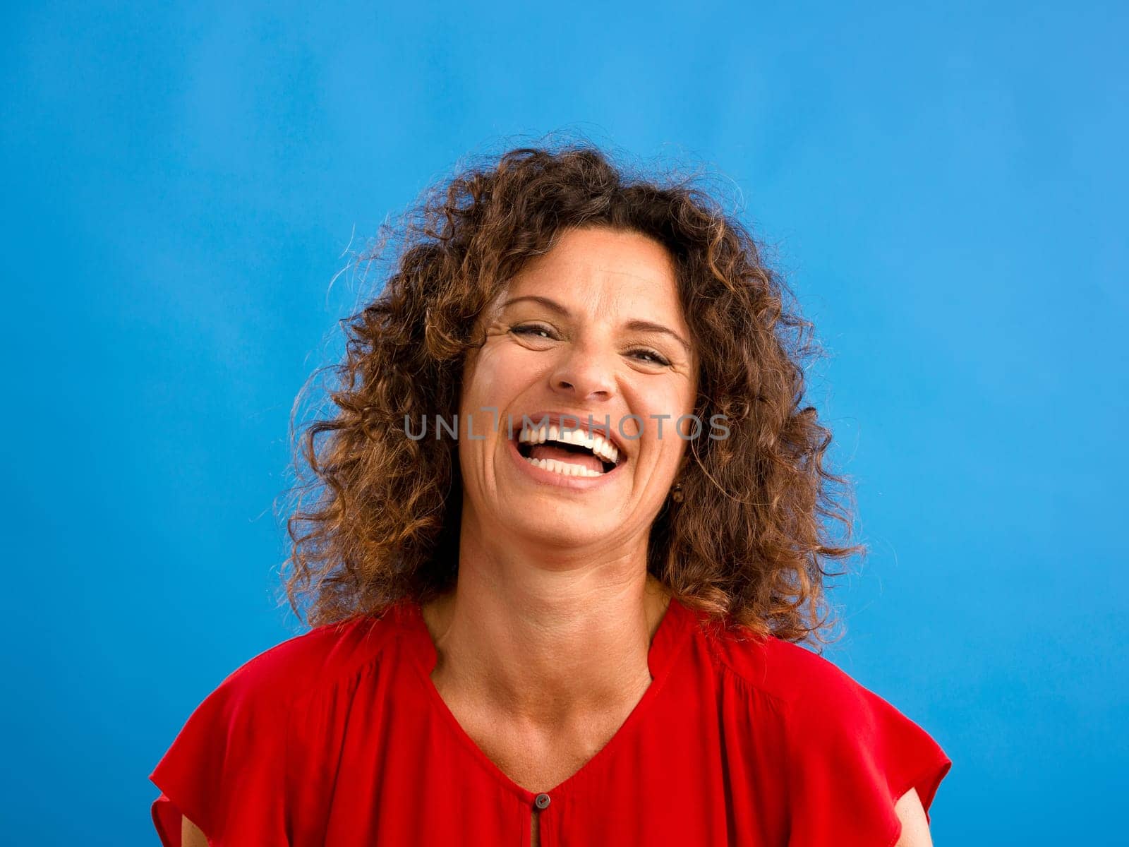 Portrait of a beautiful woman over a blue background