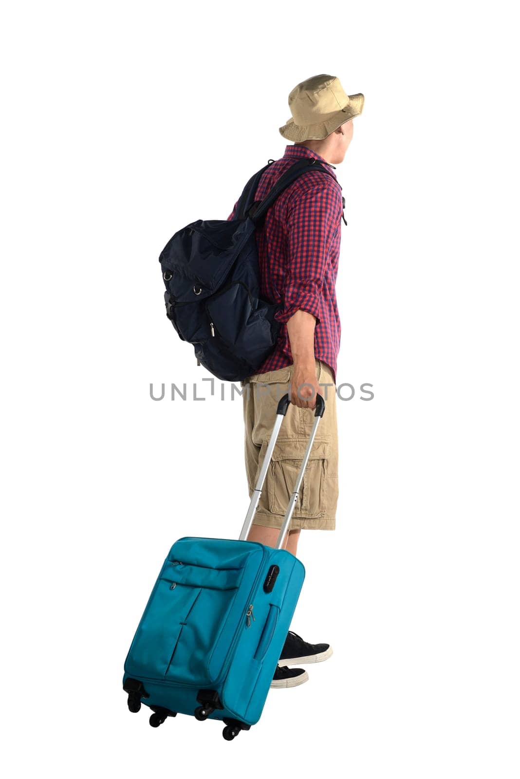 Young male tourist carry suitcase isolated over white background