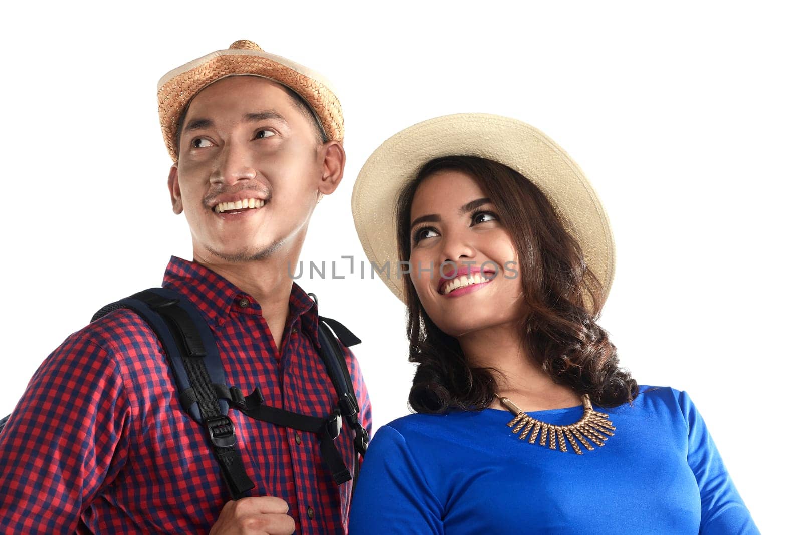 Asian tourist couple smiling isolated over white background