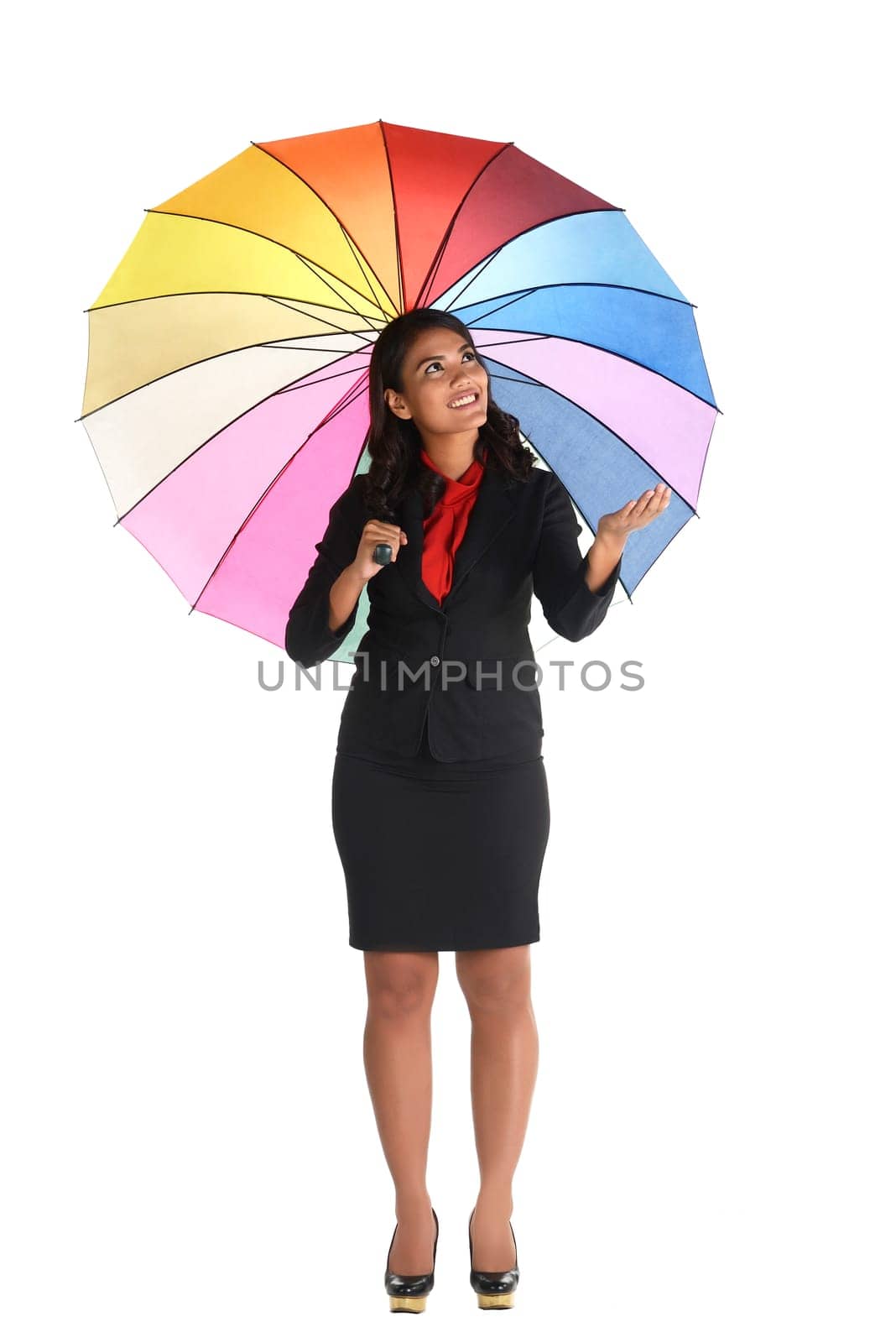 Business woman holding colorful umbrella isolated over white background