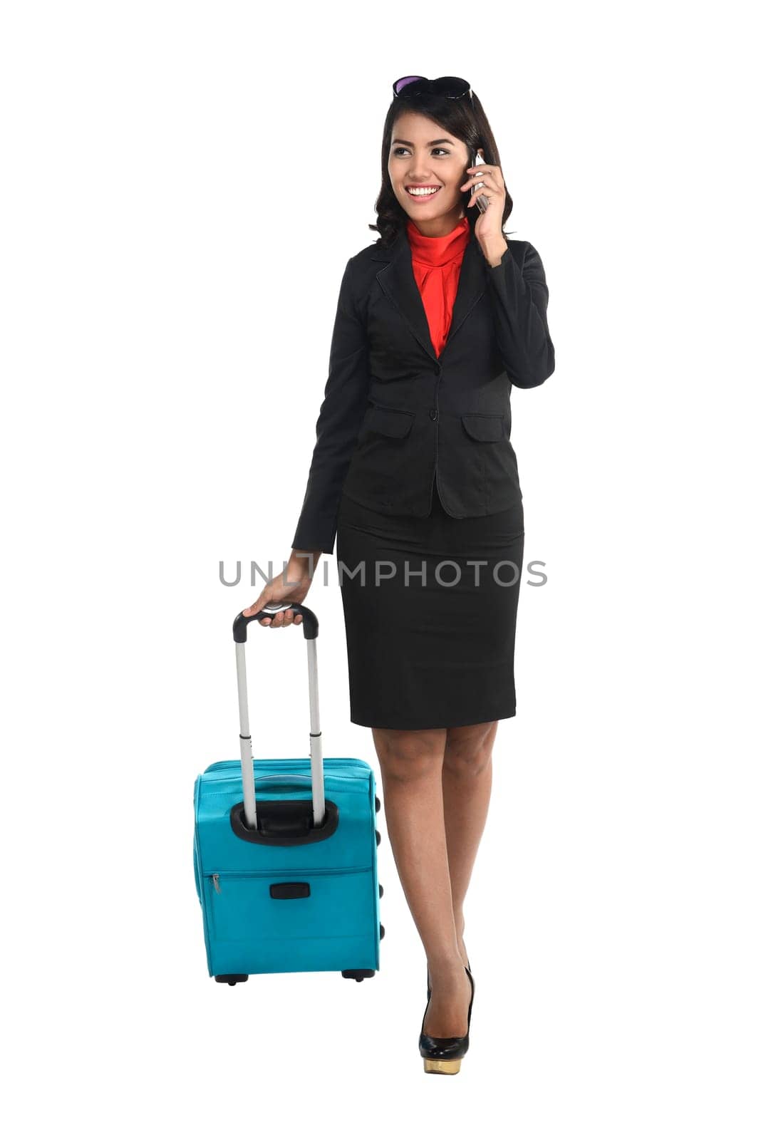 Asian business woman with cellphone and suitcase isolated over white background